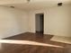 Spacious living room featuring laminate floors and ample natural light at 1203 Atlantic Ct, Kissimmee, FL 34759