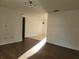 Large living room with laminate wood floors and ample natural light at 1203 Atlantic Ct, Kissimmee, FL 34759