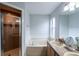 Bathroom featuring a soaking tub, shower, double sink vanity, and a neutral color palette at 1659 Sage Creek Ct, Orlando, FL 32824