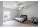 Bedroom with carpet, a ceiling fan, and a window that provides natural light at 1659 Sage Creek Ct, Orlando, FL 32824