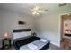 Bedroom with carpet, a ceiling fan, a window for natural light and neutral paint at 1659 Sage Creek Ct, Orlando, FL 32824
