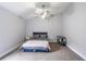 Bedroom with carpet, a ceiling fan, and a window that provides natural light at 1659 Sage Creek Ct, Orlando, FL 32824