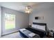Cozy bedroom featuring carpet, a ceiling fan, a window, and neutral paint at 1659 Sage Creek Ct, Orlando, FL 32824