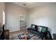 Cozy bonus room featuring hardwood floors, gaming decor, and a stylish black futon at 1659 Sage Creek Ct, Orlando, FL 32824