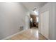 Open hallway with white doors leading to kitchen with stainless appliances at 1659 Sage Creek Ct, Orlando, FL 32824
