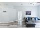 Spacious living room with wood floors and neutral color palette at 1659 Sage Creek Ct, Orlando, FL 32824