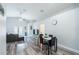 The open living room and dining area offer wood flooring, neutral walls, and patio access at 1659 Sage Creek Ct, Orlando, FL 32824