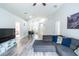 Open living area with stylish furniture and wood floors at 1659 Sage Creek Ct, Orlando, FL 32824