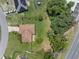 Aerial view of home showcasing the roof, yard, and surrounding neighborhood at 166 Paradise Island Dr, Haines City, FL 33844
