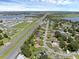 Extensive aerial perspective showing a neighborhood close to a highway and various lakes, highlighting community connections at 166 Paradise Island Dr, Haines City, FL 33844