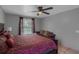 Bedroom with a queen size bed, a sofa and a window overlooking the back yard at 166 Paradise Island Dr, Haines City, FL 33844