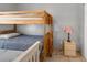 Functional bunk beds offer a space-saving sleeping solution in this cozy bedroom, along with a lamp on a small table at 166 Paradise Island Dr, Haines City, FL 33844