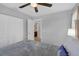 Bright bedroom with large closet, a white bed and an ensuite bathroom at 166 Paradise Island Dr, Haines City, FL 33844