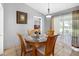 Cozy dining area adjacent to the bedroom and featuring a sliding glass door at 166 Paradise Island Dr, Haines City, FL 33844