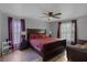 Spacious main bedroom with large windows and a comfortable bed at 166 Paradise Island Dr, Haines City, FL 33844