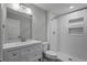 Well-lit bathroom with a modern vanity and a tiled walk-in shower at 1800 Banyan St, Orange City, FL 32763