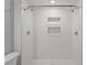 Modern bathroom featuring a tiled shower, dual showerheads and built in niches at 1800 Banyan St, Orange City, FL 32763