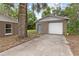 Exterior view of detached garage and additional property features at 1800 Banyan St, Orange City, FL 32763