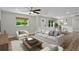 Inviting living room with neutral tones, stylish decor, and abundant natural light at 1800 Banyan St, Orange City, FL 32763