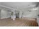 Open-concept living space with modern finishes, recessed lighting, and wood-look flooring at 1800 Banyan St, Orange City, FL 32763