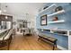 Bright dining room with hardwood floors, modern lighting, and stylish decor on floating shelves at 1845 Island Village Way, Celebration, FL 34747