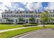 Attractive townhome with an inviting front, featuring a beautifully landscaped lawn and well-kept entryway at 1845 Island Village Way, Celebration, FL 34747