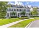 Charming townhome with manicured lawn, complemented by black shutters and a well-maintained walkway at 1845 Island Village Way, Celebration, FL 34747