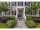Inviting front porch with lush landscaping, decorative plants, and a welcoming entryway at 1845 Island Village Way, Celebration, FL 34747