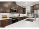 Modern kitchen featuring quartz countertops, stainless steel appliances, and custom cabinetry at 1845 Island Village Way, Celebration, FL 34747
