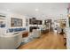 Spacious living room and kitchen with hardwood floors and stylish modern furniture at 1845 Island Village Way, Celebration, FL 34747