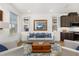 Inviting living room featuring built-in shelving, comfortable seating, and natural light at 1845 Island Village Way, Celebration, FL 34747
