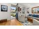 Open front door leading to the living room with stylish decor, hardwood floors, and natural light at 1845 Island Village Way, Celebration, FL 34747