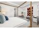 Bright main bedroom featuring a four-poster bed, white walls, and tray ceiling at 1845 Island Village Way, Celebration, FL 34747
