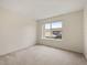 Bedroom featuring a large window, neutral walls, and carpeted floors at 2050 Island Walk Dr, Orlando, FL 32824