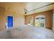 Spacious two car garage with a blue entry door and access to the backyard at 2050 Island Walk Dr, Orlando, FL 32824