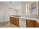 Functional kitchen featuring wood cabinets, and white appliances at 2050 Island Walk Dr, Orlando, FL 32824