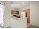 A well-lit kitchen featuring light wood cabinets and a bar counter at 2050 Island Walk Dr, Orlando, FL 32824