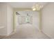 Spacious living area with neutral carpeting and a ceiling fan at 2050 Island Walk Dr, Orlando, FL 32824