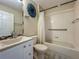Bathroom with vanity, sink, commode, mirror, and shower-bath tub combination at 2054 Hammock Moss Dr, Orlando, FL 32820