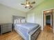 Bedroom with wood flooring, ceiling fan, walk in closet, and neutral walls at 2054 Hammock Moss Dr, Orlando, FL 32820