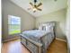 Bedroom featuring a lake view from window, neutral walls, and ceiling fan at 2054 Hammock Moss Dr, Orlando, FL 32820