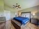 A relaxing bedroom setting with a large bed, side tables, and ample natural light at 2054 Hammock Moss Dr, Orlando, FL 32820