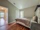Bedroom featuring neutral walls, hardwood floors, and closet space at 2054 Hammock Moss Dr, Orlando, FL 32820