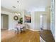 Cozy dining area featuring hardwood floors, pendant lighting, and seamless transition to the kitchen at 2054 Hammock Moss Dr, Orlando, FL 32820