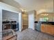 Open kitchen adjacent to laundry room with stainless steel washer and dryer at 2054 Hammock Moss Dr, Orlando, FL 32820