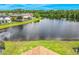 Picturesque pond view surrounded by lush greenery, offering serene backdrop to the home at 2054 Hammock Moss Dr, Orlando, FL 32820