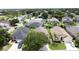 Features a residential street showcasing the home's facade and manicured lawn in a suburban setting at 2649 Hemingway Ave, Haines City, FL 33844