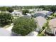 Highlights a residential street with trees and landscaping in a serene suburban setting at 2649 Hemingway Ave, Haines City, FL 33844