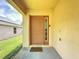 Inviting front entrance with a classic door, sidelight, and a 'Welcome' mat at 2649 Hemingway Ave, Haines City, FL 33844