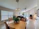 Comfortable living space with tile floors, a ceiling fan, and sliding glass doors at 2649 Hemingway Ave, Haines City, FL 33844